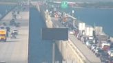 Overturned vehicle has traffic on I-10W at the Twin Span at a standstill