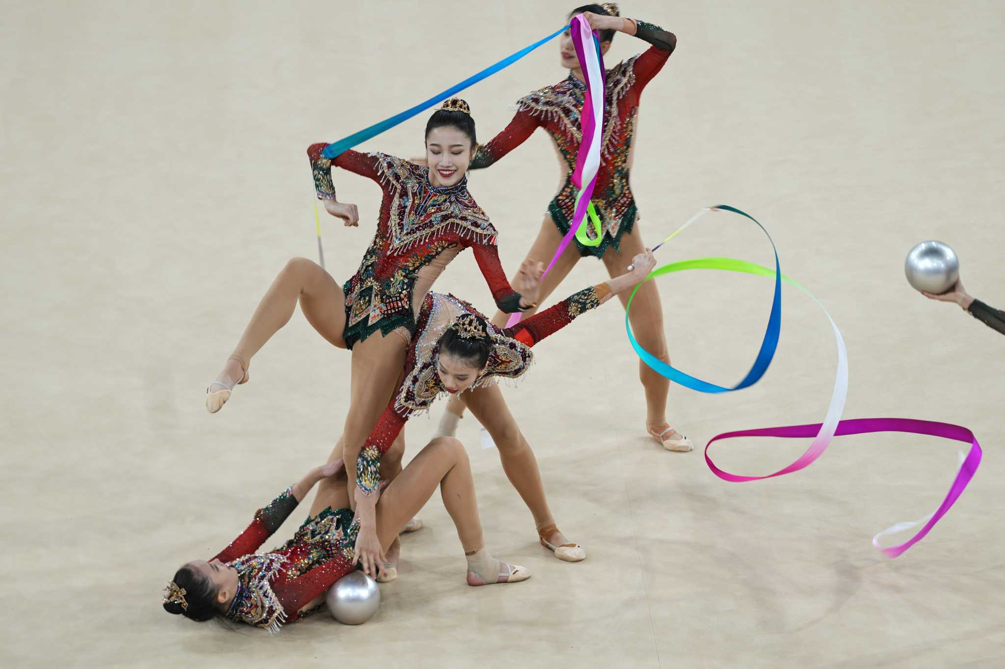 China becomes first non-European country to claim Olympic gold in rhythmic gymnastics