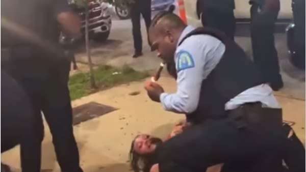 St. Louis Police Officer Lit a Cigar While Straddling Suspect