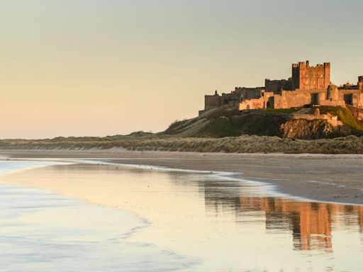 Enchanting beach with a postcard-perfect castle backdrop