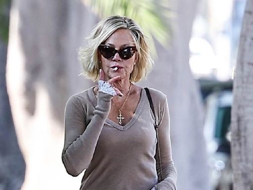 Melanie Griffith puffs on cigarette as she steps out on LA outing