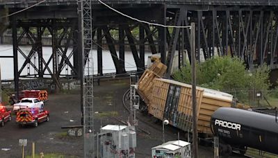 A train derailment shuts down a historic bridge that carries cars and trains in Portland, Oregon