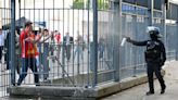 Liverpool fans sprayed with tear gas in Champions League final chaos as club demands investigation