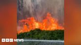 Watch: Huge fires blaze along Miami highway