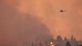 Extreme heat fuels wildfires in Alberta and B.C., forcing hundreds to flee