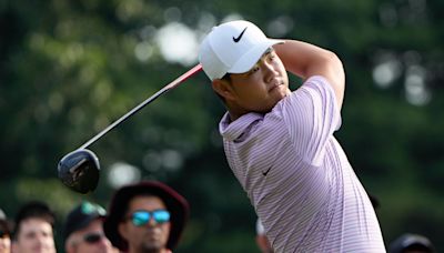 Tom Kim keeps lead as Shane Lowry and Robert MacIntyre shoot into contention