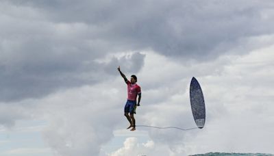 This surfer already won the Olympics with his gravity-defying pose