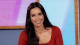 Christine Lampard is a siren in fitted cream dress and tumbling curls