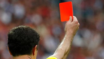 Champions League referees detained after allegedly stealing road sign