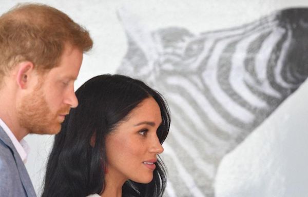 Prince Harry and Meghan Markle All Smiles in Nigeria After Secretly Reuniting in London