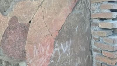 Tourist is caught carving initials into 2,000-year-old home at Pompeii | CNN