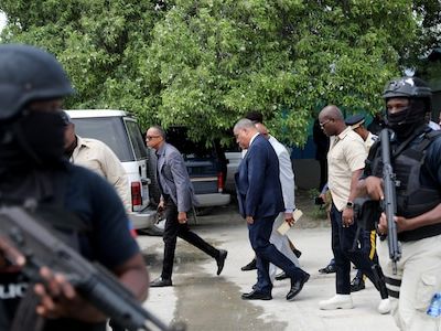 Security officers cover Haiti's prime minister with gunfire as he leaves hospital - CNBC TV18