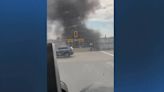 Car drives off Boston on-ramp, burst into flames on train tracks below