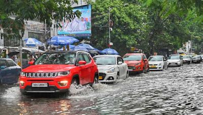 Khunti puja, monsoon showers and more Kolkata news in pictures