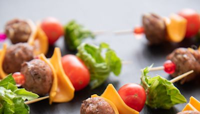 Kick off your summer cookout with turkey meatball appetizer served on skewers