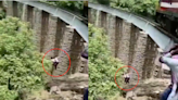 Video: Couple On Photoshoot Jumps Into 90-Ft Gorge To Avoid Getting Run Over By Train