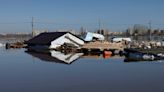 Russia and Kazakhstan battle record floods as rivers rise further