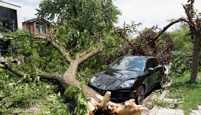 A dam fails after rain, wind, tornadoes pound the Midwest. The Chicago area is cleaning up