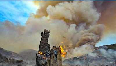 Spurred by heat wave, wildfires rage across Southern California