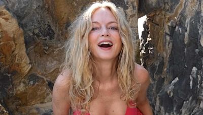 Heather Graham, 54, models skimpy bikinis at the beach in Italy