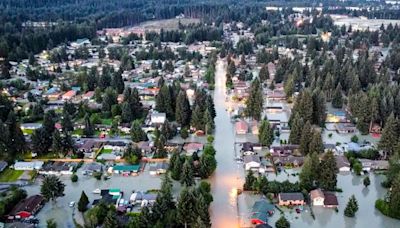 After a burst ice dam unleashed a flood, residents in Alaska's capital clean up swamped homes