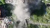 Ukrainian drones drop bombs on Russian soldiers hiding in damaged buildings