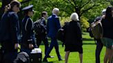 Pictured: Joe Biden ‘uses team of walkers to hide shuffling gait’