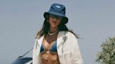 Izabel Goulart models a skimpy denim bikini before outdoor shower