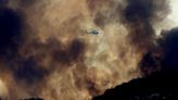 Firefighters battle massive fire near Hemet from the sky at night