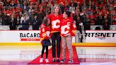 Family of late Chris Snow drops ceremonial puck at Flames opener