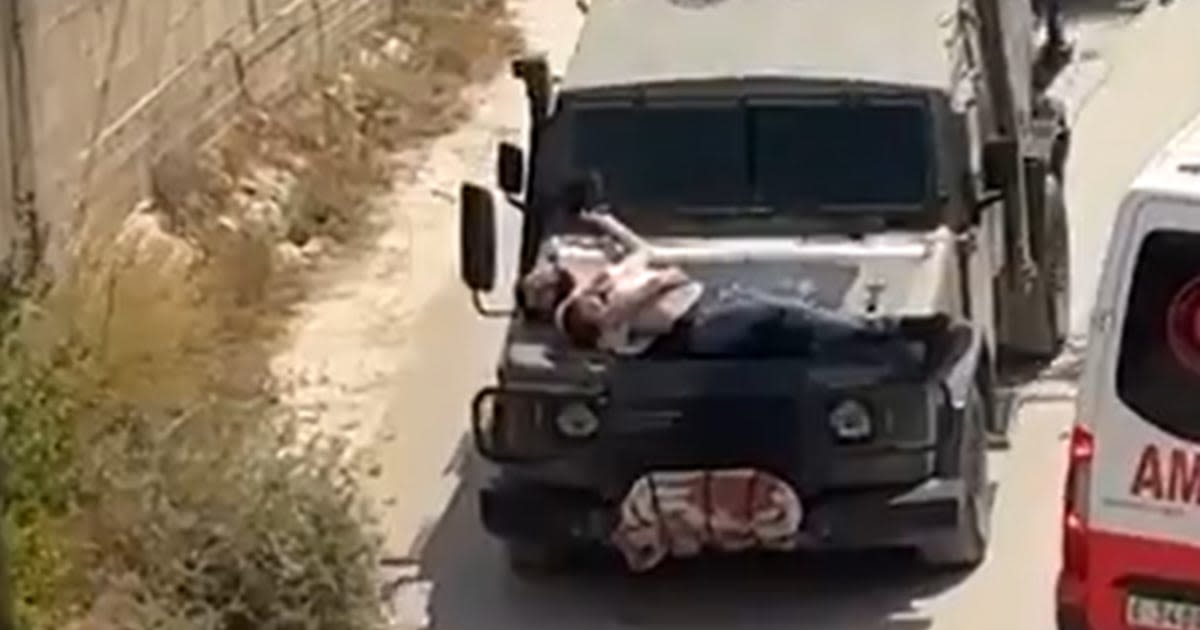 Video of Israeli soldiers driving with injured Palestinian strapped to a jeep sparks outrage