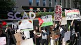 SCAD students protest along Peachtree in Atlanta