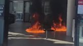 Man charged after car dealer set alight in front of terrified customers