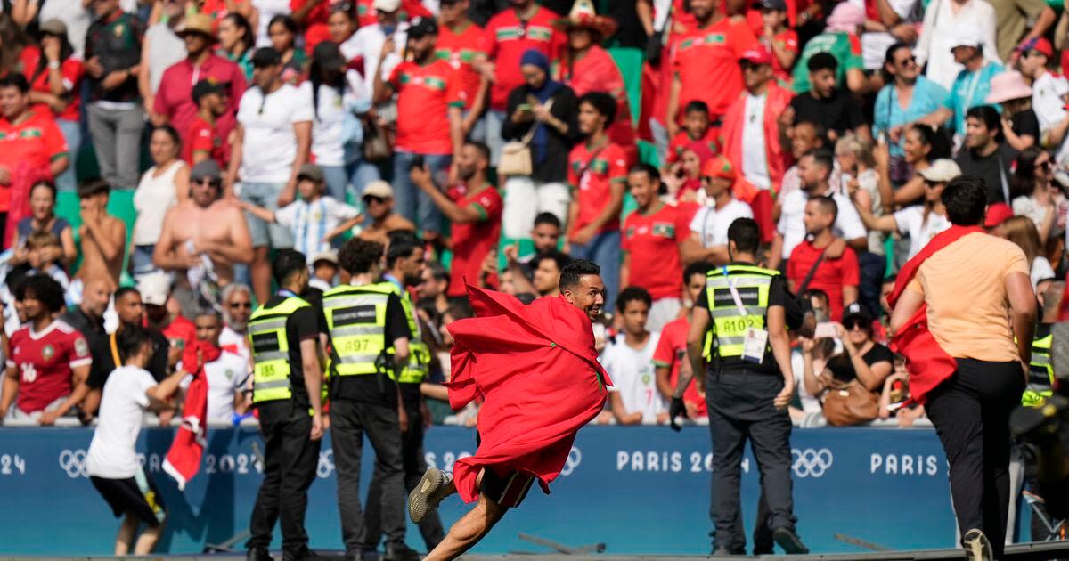 Olympic soccer gets off to violent and chaotic start as Morocco fans rush the field vs Argentina