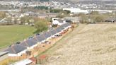 Travellers told to stop digging into Welsh hillside over fears of landslip