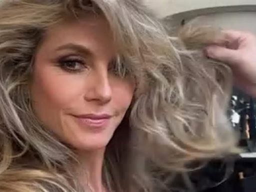 Heidi Klum, 50, looks like a FemBot from Austin Powers as she models a pink negligee while getting glammed up for America's Got Talent