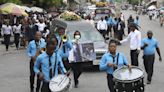 Hundreds mourn gang killings of Haitian mission director and young U.S. couple