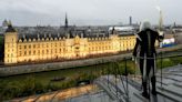 Live: The Olympic flame is carried over Parisian rooftops to the sound of the Marseilleise