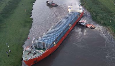 Cargo ship freed after becoming stuck in river