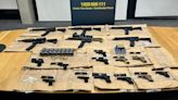 PIC: 6 assault rifles, 12 semi-automatic handguns and 900 rounds of ammo seized