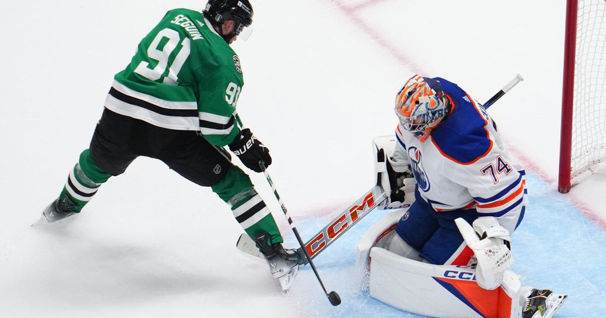 ...Oilers goaltender Stuart Skinner makes a save against the Dallas Stars' Tyler Seguin during the second period in Game 2 of the Western Conference Final of at American...