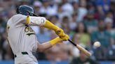 A's pull away late to pound Mariners