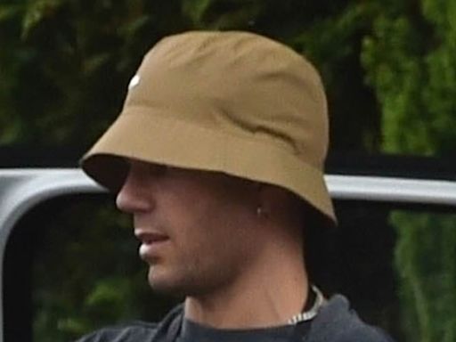 Max George dons elbow compression sleeve while out with Maisie Smith