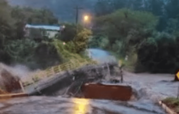 Bridge washes away on video as mayor warns of floods