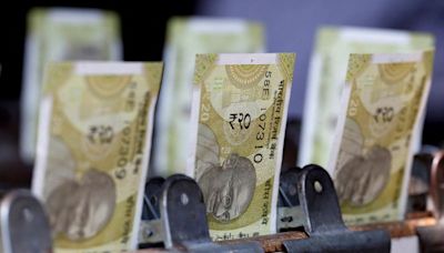 Rupee ends weaker, pressured by state-run banks' dollar bids; eye on US inflation