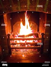 Roaring fire in a brick fireplace Stock Photo - Alamy