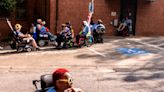 Disability rights activists block DHHS doors during Raleigh protest, risking arrest