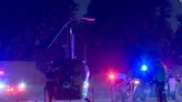 A helicopter halts traffic on the 110 Freeway in South Los Angeles