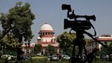 India's top court orders release of journalist held in illegal funding case