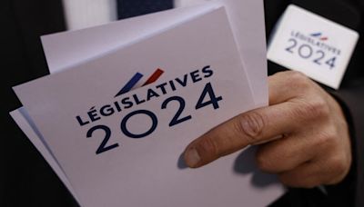Rival parties race to block far right as France heads toward legislative run-off